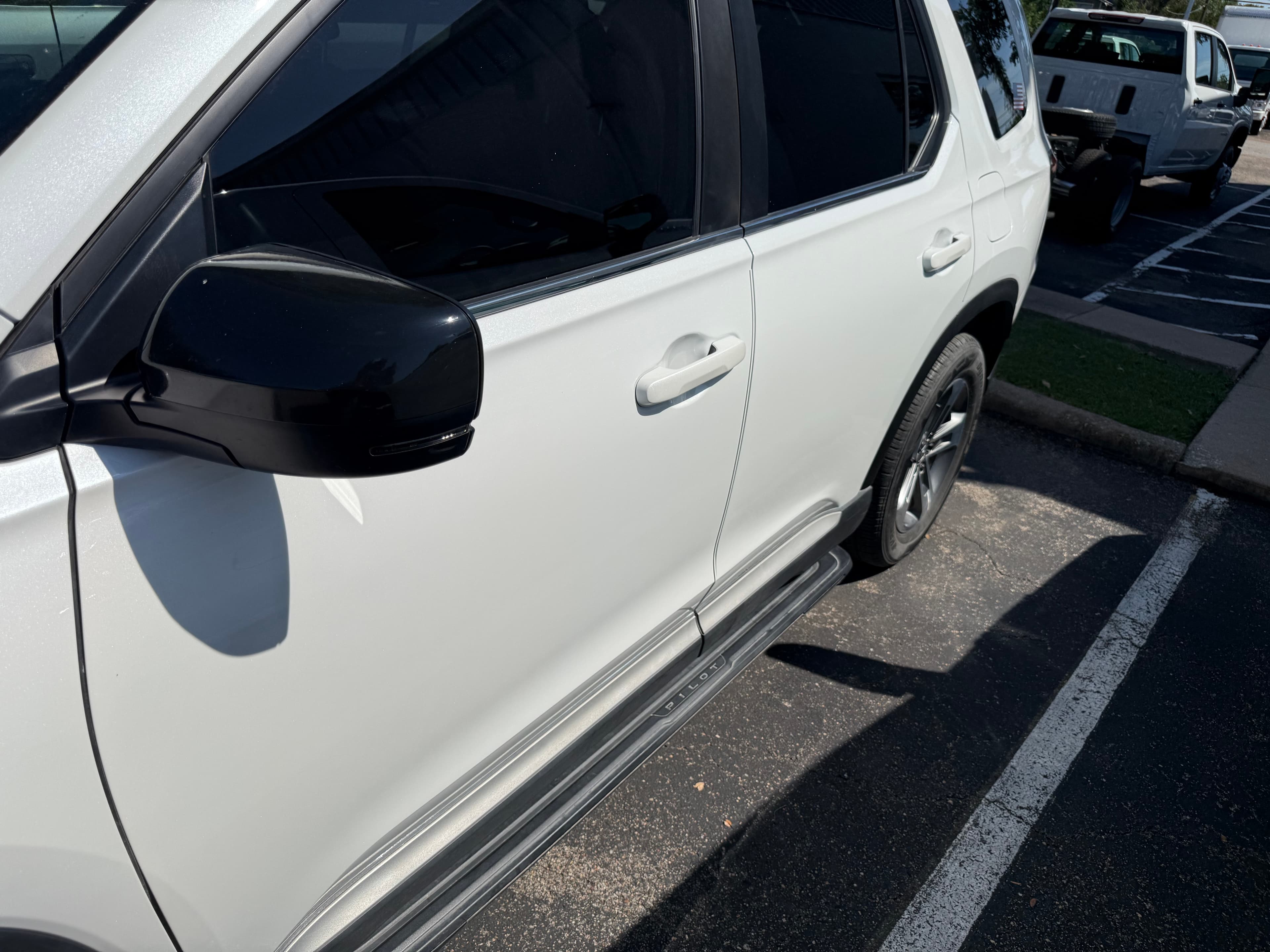 After: 2025 Honda Pilot pearl white collision dent repair before and after at Auto Art Austin TX