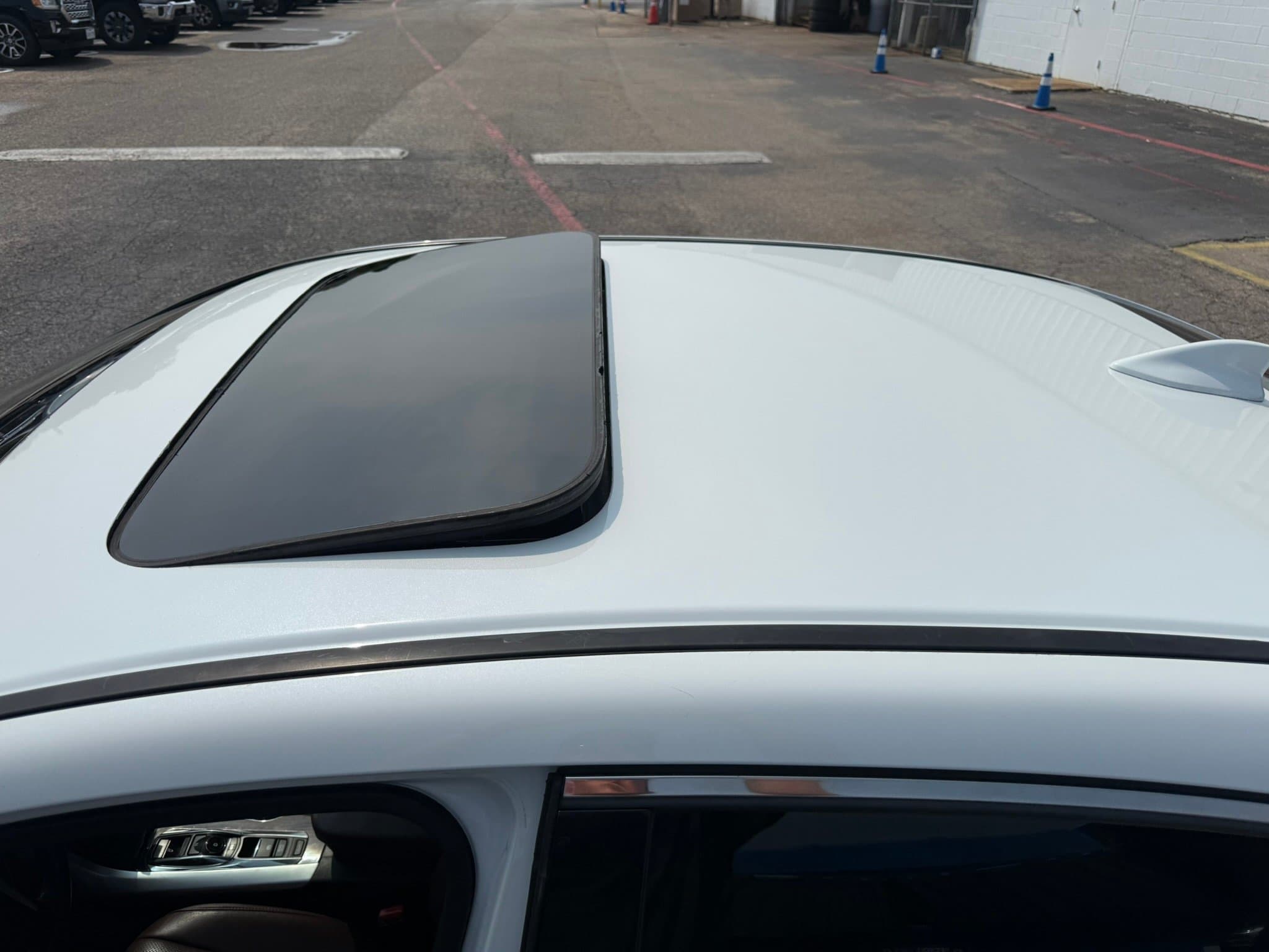 After: 2017 Acura TLX roof before and after vinyl wrap removal and repaint in white Austin TX