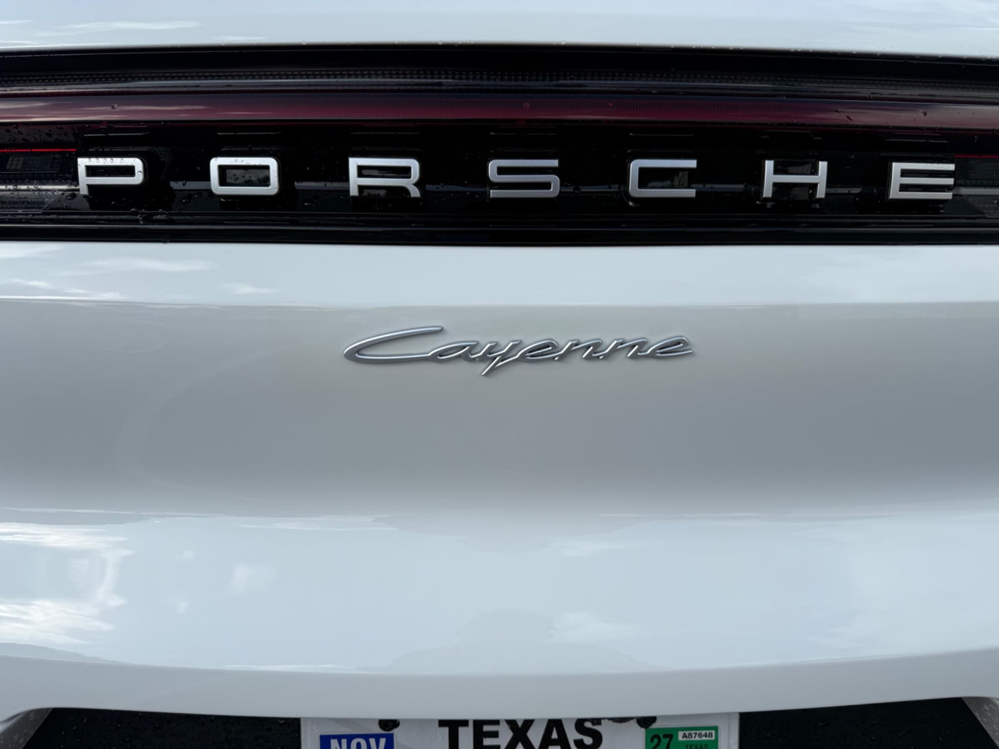 After: Before and after scratch repair on white Porsche Cayenne tailgate at Auto Art in Austin TX